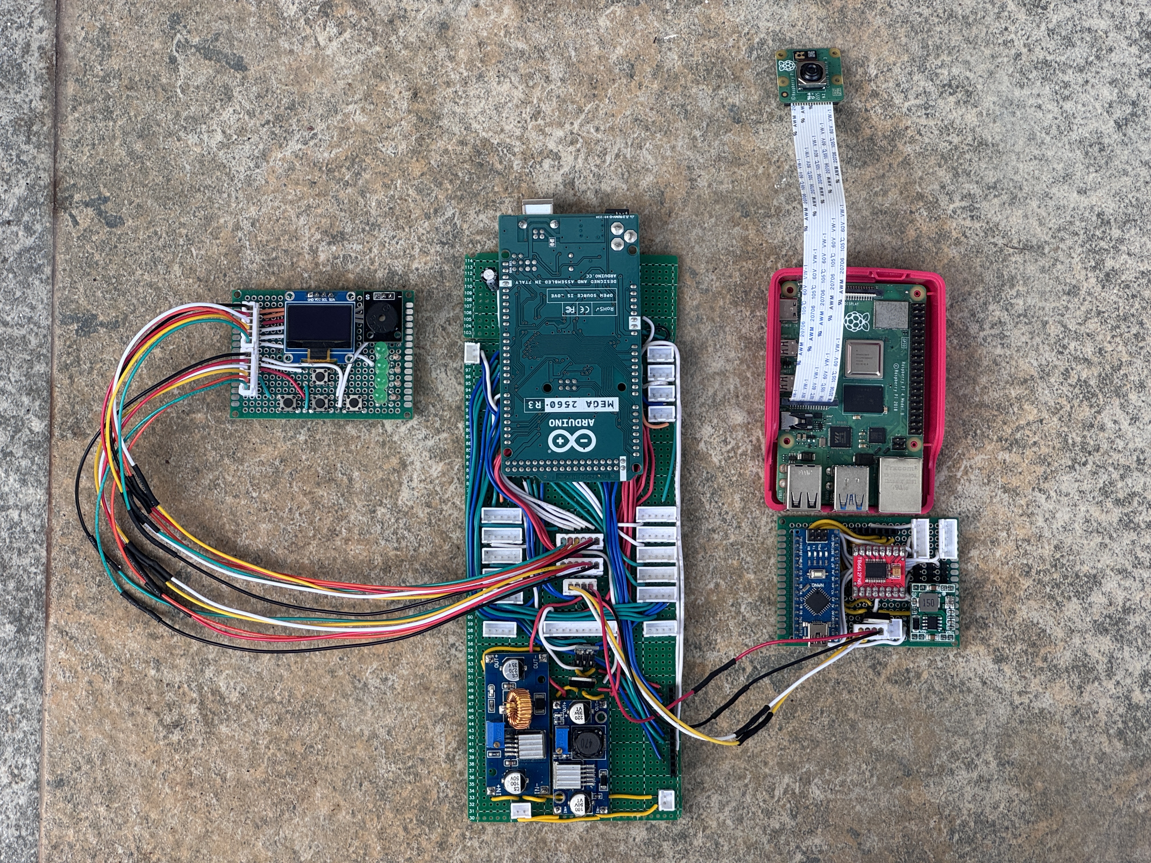 The full electronics stack — Raspberry Pi 4, Arduino Mega, camera and driver boards